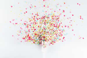 Confetti Falling From A Bottle Wallpaper