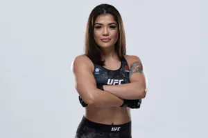 Confident Female Fighter U F C Attire Wallpaper