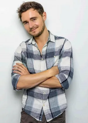 Confident Manin Plaid Shirt Wallpaper