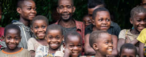 Congolese Family Smiling Together Wallpaper