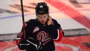 Connor Bedard Hockey Player On Ice Wallpaper