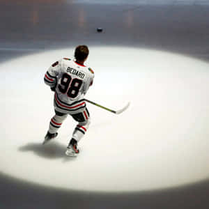 Connor Bedard Hockey Player On Ice Wallpaper
