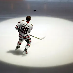 Connor Bedard Hockey Player On Ice Wallpaper