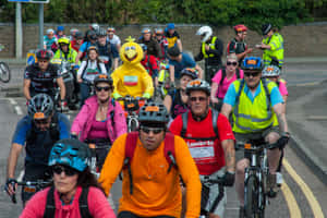 Conspicuous Man Wearing A Big Bird Costume In A Marathon Wallpaper