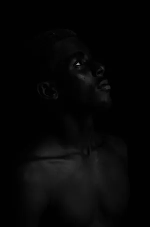 Contemplative_ Gaze_in_ Shadows.jpg Wallpaper