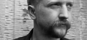 Contemplative Man Blackand White Portrait Wallpaper