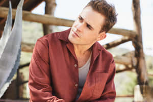 Contemplative Man Outdoors Wallpaper