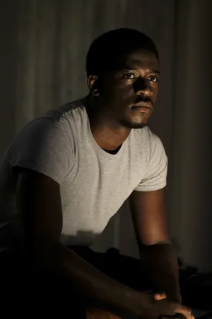 Contemplative Manin Dim Light Wallpaper