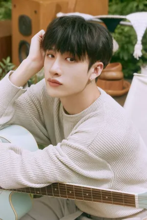 Contemplative Musician Garden Setting Wallpaper