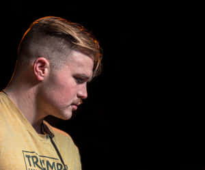 Contemplative Musician Profile Wallpaper