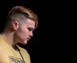 Contemplative Musician Profile Wallpaper