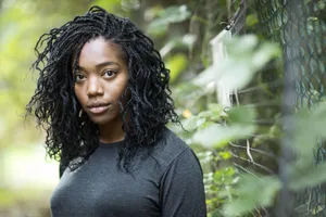 Contemplative Woman Near Fence Wallpaper