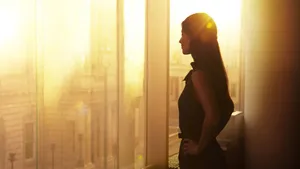 Contemplative Woman Sunset Silhouette Wallpaper