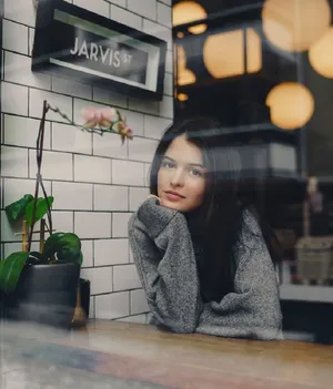 Contemplative Womanat Cafe Wallpaper