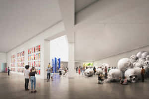 Contemporary_ Art_ Gallery_ With_ Visitors_and_ Sculptures Wallpaper