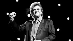 Conway Twitty Performingon Stage Wallpaper