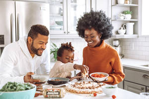 Cooking Together Makes For A Happy Family Wallpaper