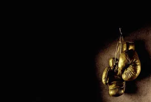 Cool Boxing Gloves Hanging On Wall Wallpaper