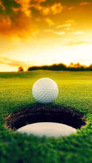Cool Golf Ball Beside The Goal Wallpaper