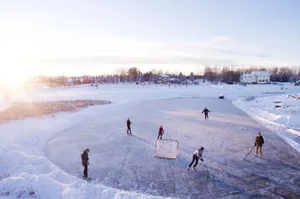 Cool Hockey Players Skate Through The Ice Wallpaper