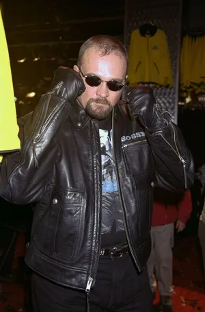 Cool Leather Jacket Man Adjusting Sunglasses Wallpaper