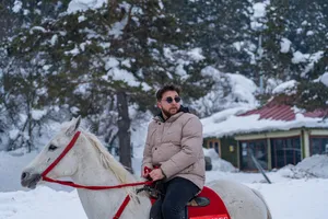 Cool Man Riding A Horse In Winter Wallpaper