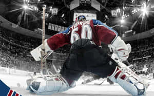 Cool Nhl Hockey Player Making Save Wallpaper