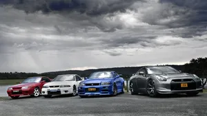 Cool Nissan Skyline Gtrs Next To Each Other Wallpaper