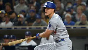 Corey Seager Swinging Bat In Uniform Wallpaper
