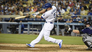 Corey Seager Swinging While Skipping Wallpaper