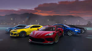 Corvette_ C8_ Amidst_ Sports_ Cars_at_ Dusk Wallpaper