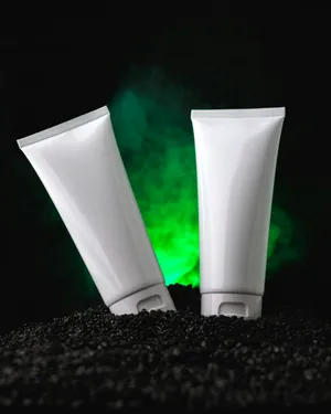 Cosmetic Tubes Mockup Green Backdrop Wallpaper