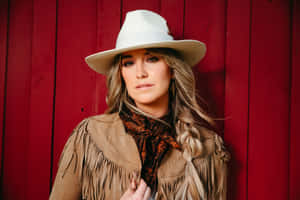 Country Music Artist Against Red Background Wallpaper