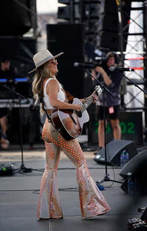 Country Music Performer On Stage.jpg Wallpaper