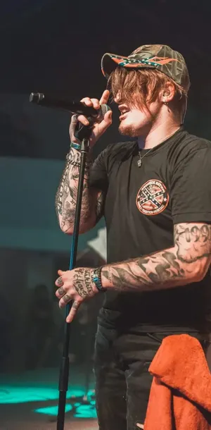 Country Music Performer On Stage.jpg Wallpaper