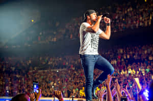 Country Music Superstar Luke Bryan Shines Onstage Wallpaper