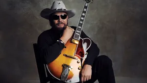 Country Musicianwith Guitar Wallpaper