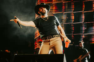 Country Singer Performanceon Stage.jpg Wallpaper