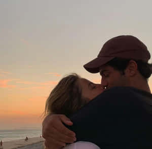 Couple Enjoying A Romantic Moment Together Wallpaper