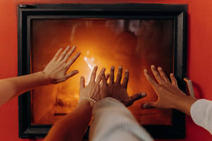 Couple Hands Fireplace Wallpaper