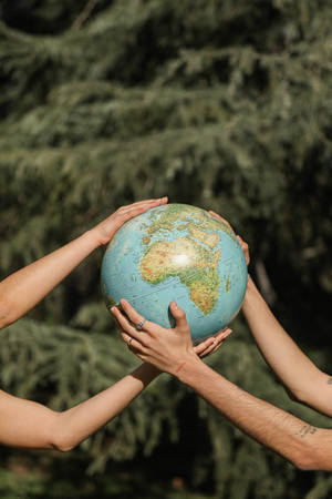 Couple Hands Holding Globe Wallpaper