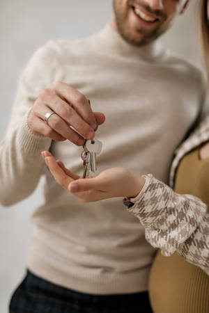 Couple Hands Key Sharing Wallpaper