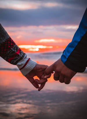 Couple Hands Orange Sunset Wallpaper