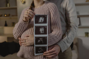 Couple Hands Ultrasound Photo Wallpaper