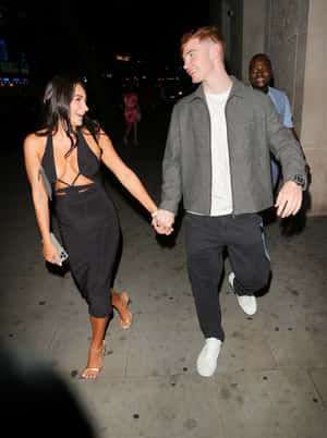 Couple Holding Hands Night Out Wallpaper