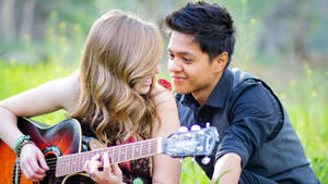 Couple Playing Guitar Wallpaper