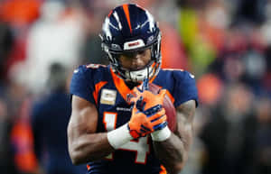 Courtland Sutton Catching Football During Game Wallpaper