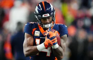 Courtland Sutton Catching Football During Game Wallpaper