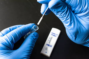 Covid Test Swab And Tube Wallpaper