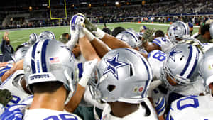 Cowboys Players Showing Their Team Spirit Wallpaper